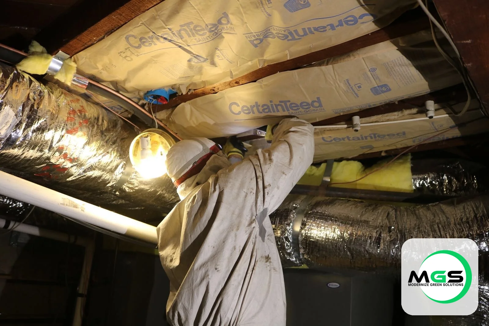 Professional attic insulation crew at work in a South Florida home