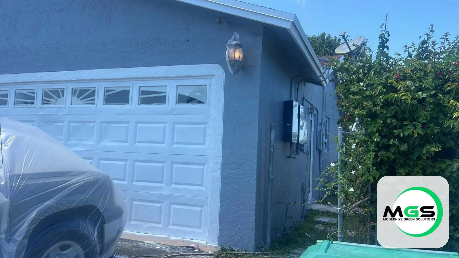 Exterior repaint with garage by Modernize Green Solutions