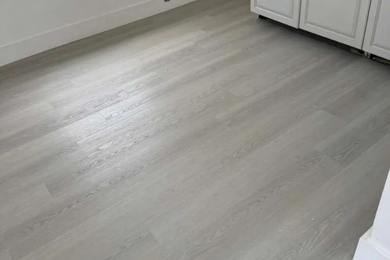New grey vinyl plank flooring installed by MGS in a West Palm Beach home