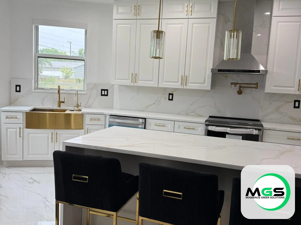 Kitchen remodel with a navy island, gold barstools, and quartz counters by Modernize Green Solutions