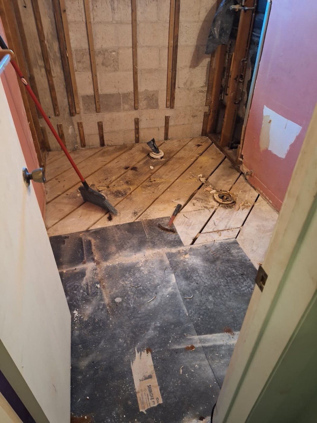 The old floor up and the bathroom opened down to the joists.