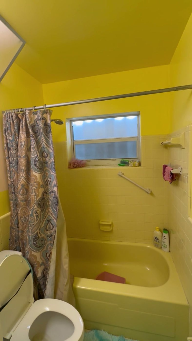 Before: the original yellow tub and shower, curtain and all.