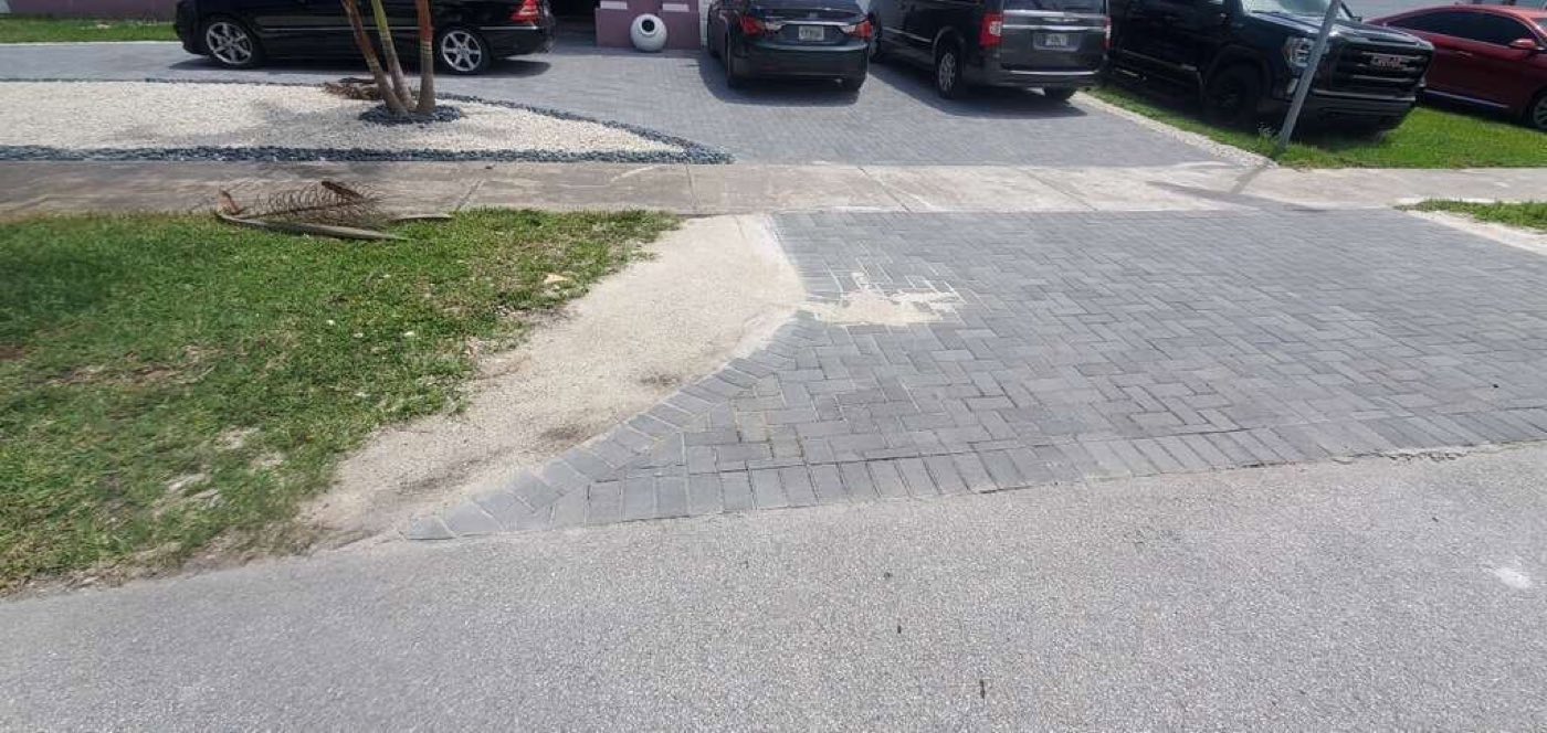 The paver edge and gravel border along the lawn.