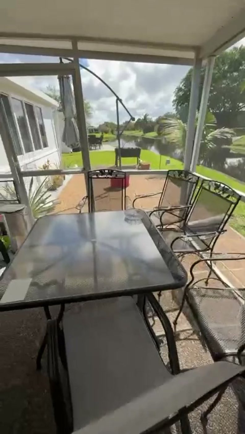 Before: the old pebble-finish floor in the screened lanai.