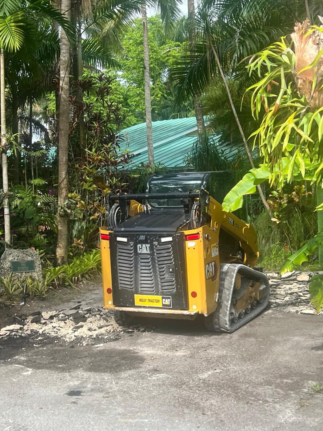The old surface broken out and cleared with a skid-steer.
