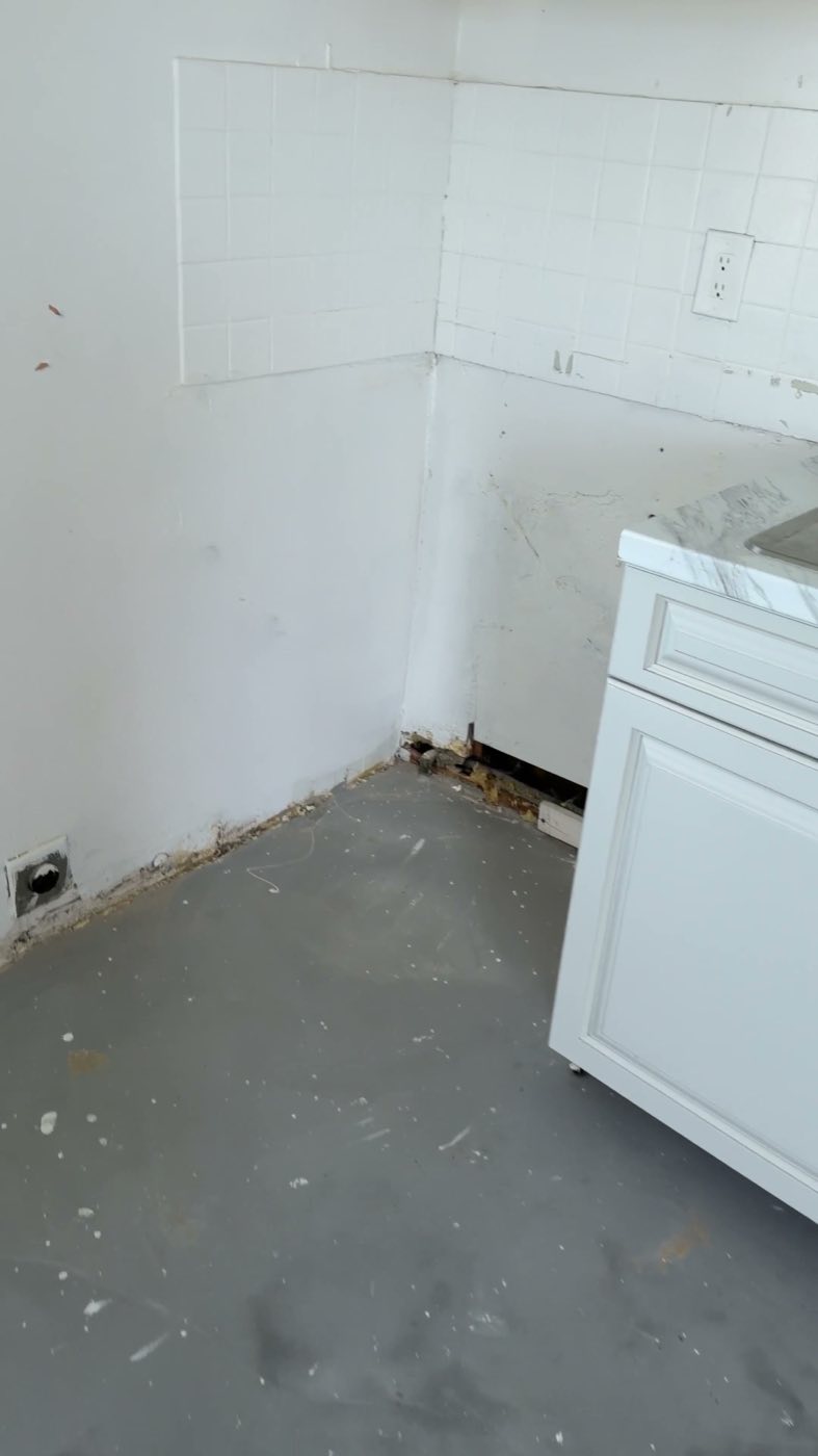 The old tile lifted and the room taken back to the bare slab.