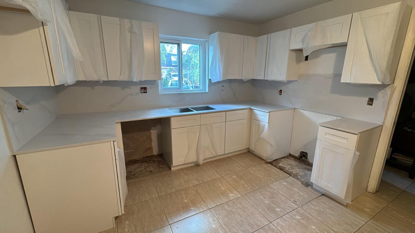 New cabinets and counters set, doors still wrapped.