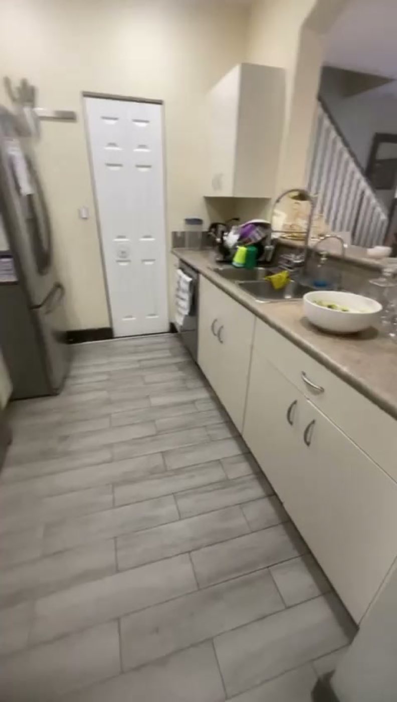 Before: the original white cabinets and beige laminate counter.