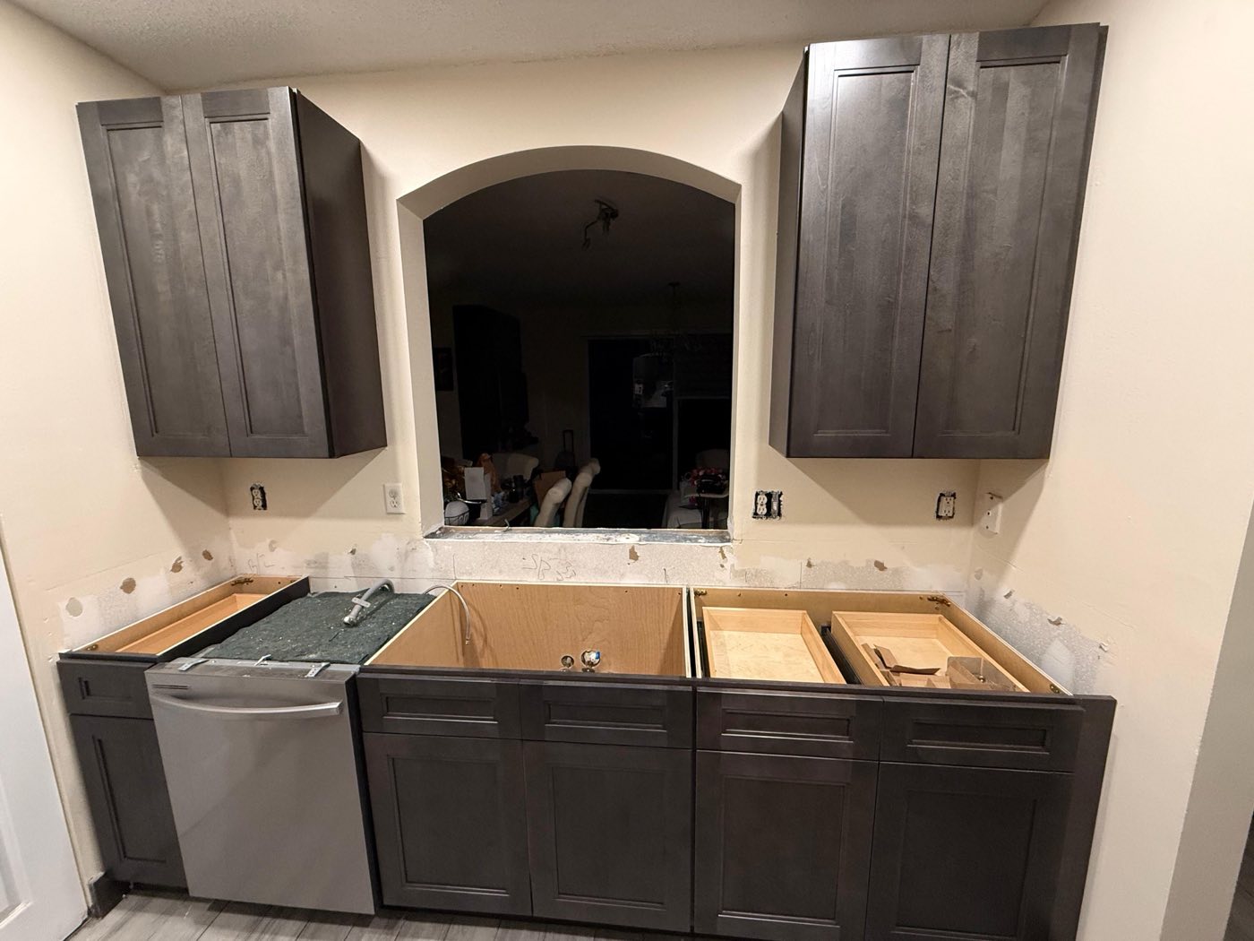Espresso cabinetry set and levelled, countertops not yet templated.