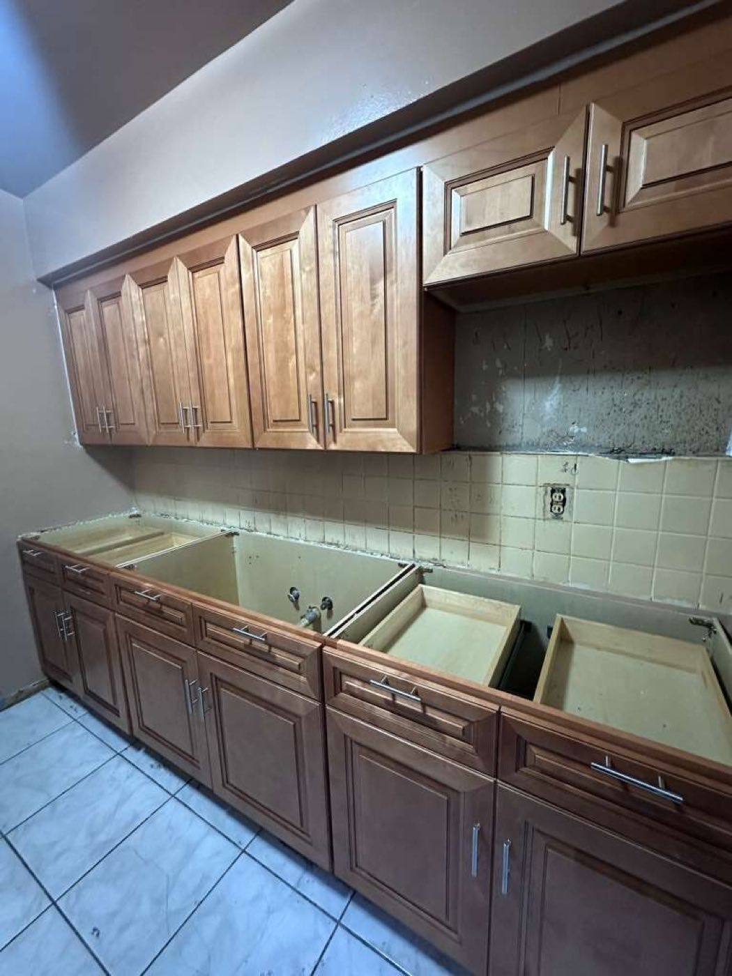 Cement board over the opened wall, ready to take the new backsplash.