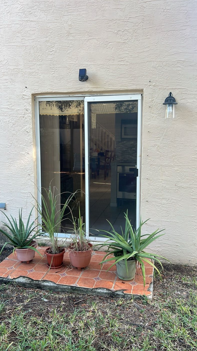 Before: the original sliding glass door the French doors replaced.