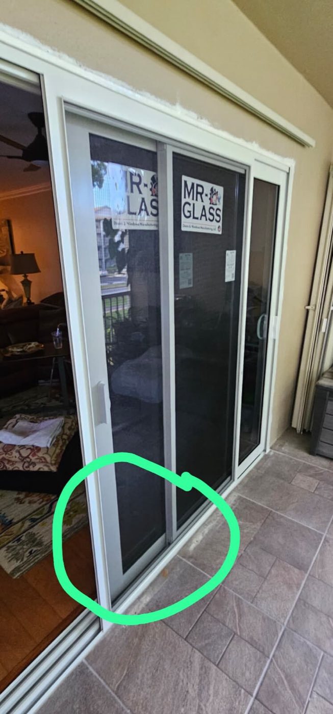 Before: the original sliding glass door and its worn track.